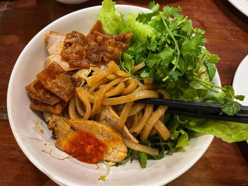 Miss Ly Staff Explained How to eat Cao Lau