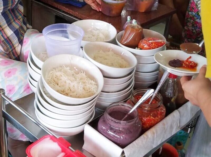 Preparing for a bowl of Bun Rieu