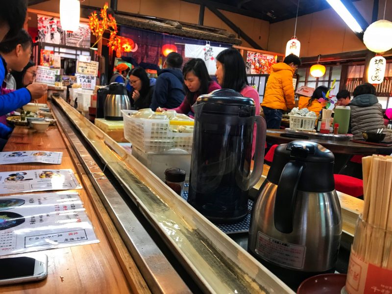 Somen passing through the flowing bamboo slide